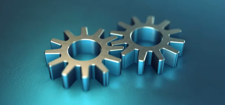 Kugghjul mot blå bakgrund